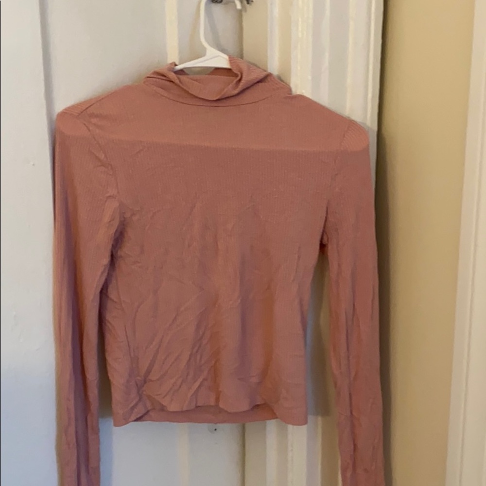 Woman pink turtleneck
